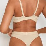 Complete your elegant look with our matching Ribbed Thong in latté. Designed with the same soft and breathable fabric blend as our bralet, this thong offers minimal coverage and a smooth, comfortable fit. The ribbed texture and elastic waistband with our signature logo provide both style and secure support.