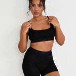 Our Ribbed Boxer in Black is the ideal choice for those seeking more coverage. With its high-rise waist and comfortable, full-coverage design, this boxer is sure to become a staple in your collection. The ribbed fabric provides a tailored fit while the elastic waistband, adorned with our signature logo, ensures a secure, all-day hold. Whether you're relaxing at home or getting ready for bed, these boxers offer unmatched comfort.