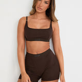 Introducing our Ribbed Strappy Bralet in chocolate - the perfect blend of style and comfort. Made with breathable Lyocel, cotton, and spandex, this seamless bralet offers soft support and a flattering scoop neckline. The 2-way adjustable straps allow for a customised fit, making it ideal for lounging and layering. Elevate your everyday look with its sophisticated ribbed texture.